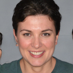 Joyful white adult female with short  brown hair and brown eyes