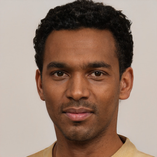 Neutral black young-adult male with short  black hair and brown eyes