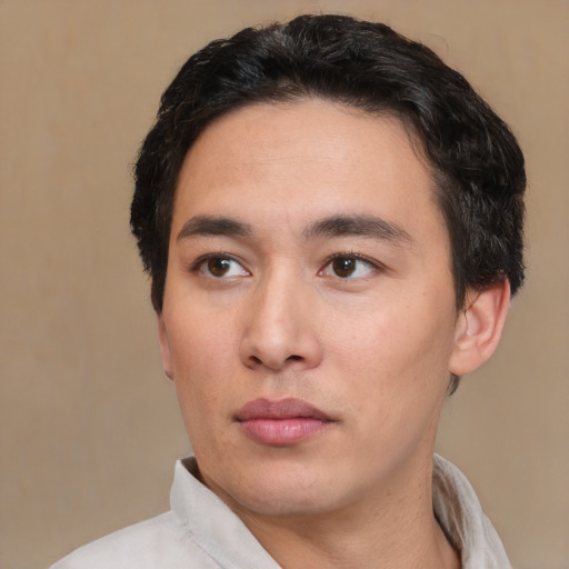Neutral white young-adult male with short  black hair and brown eyes
