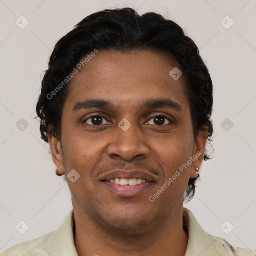 Joyful black young-adult male with short  brown hair and brown eyes