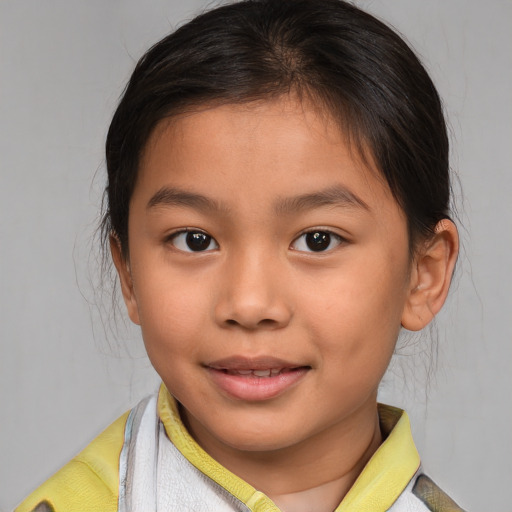 Joyful white child female with medium  brown hair and brown eyes