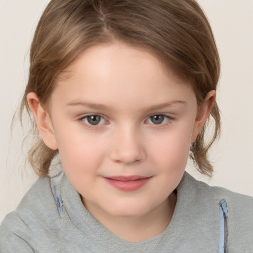 Joyful white child female with medium  brown hair and brown eyes