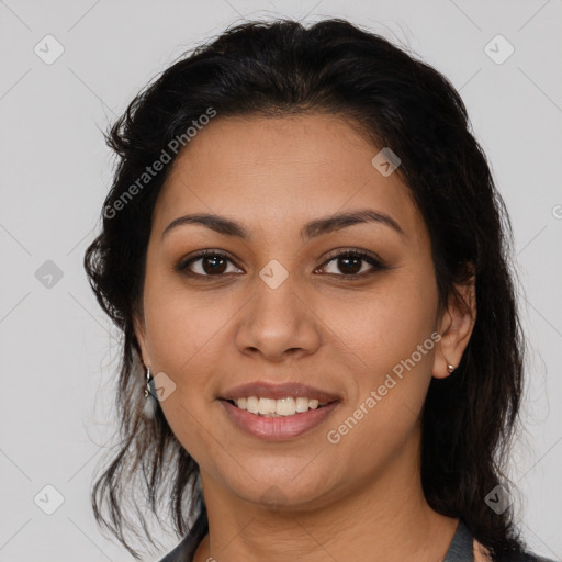 Joyful latino young-adult female with medium  brown hair and brown eyes