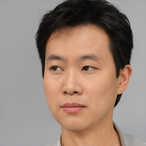 Neutral asian young-adult male with short  black hair and brown eyes