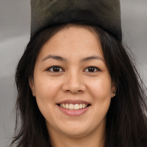 Joyful asian young-adult female with long  brown hair and brown eyes