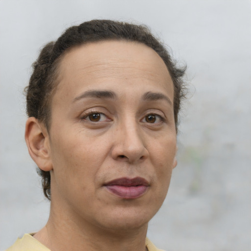 Joyful white adult female with short  brown hair and brown eyes