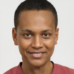 Joyful black young-adult male with short  brown hair and brown eyes