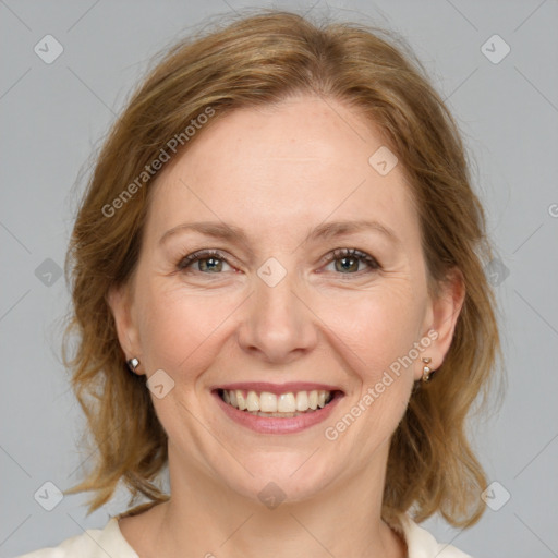 Joyful white adult female with medium  brown hair and grey eyes