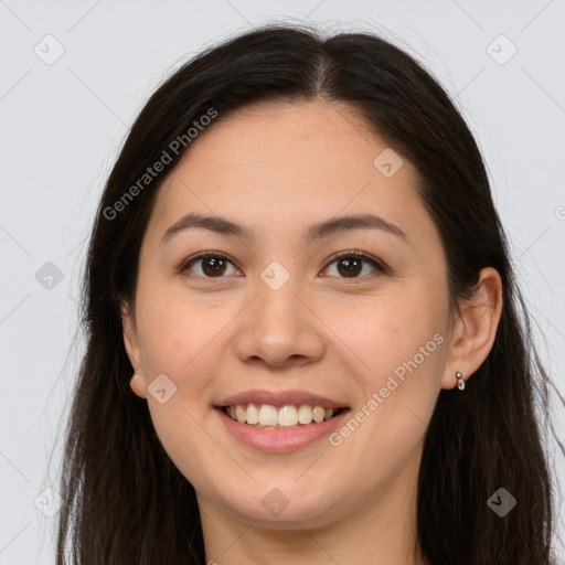 Joyful white young-adult female with long  brown hair and brown eyes