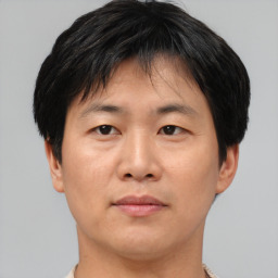 Neutral asian young-adult male with short  brown hair and brown eyes