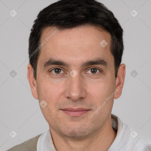 Joyful white young-adult male with short  black hair and brown eyes