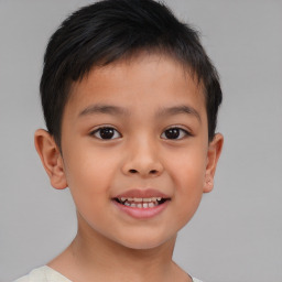 Joyful white child male with short  brown hair and brown eyes