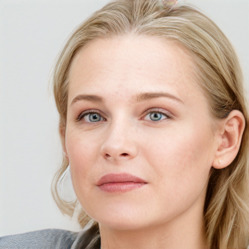 Joyful white young-adult female with long  brown hair and blue eyes