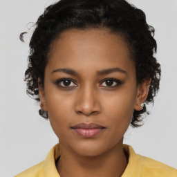 Neutral black young-adult female with short  black hair and brown eyes