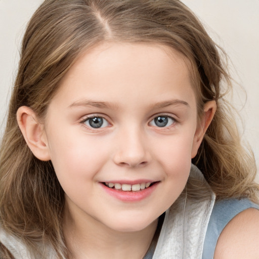 Joyful white child female with long  brown hair and blue eyes