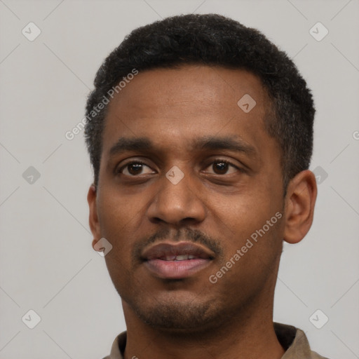 Neutral latino young-adult male with short  black hair and brown eyes