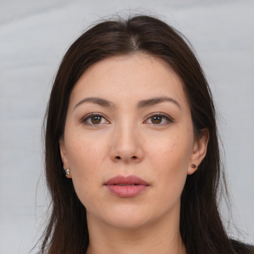 Neutral white young-adult female with long  brown hair and brown eyes