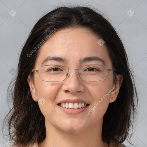 Joyful white adult female with medium  brown hair and brown eyes