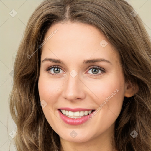 Joyful white young-adult female with long  brown hair and green eyes