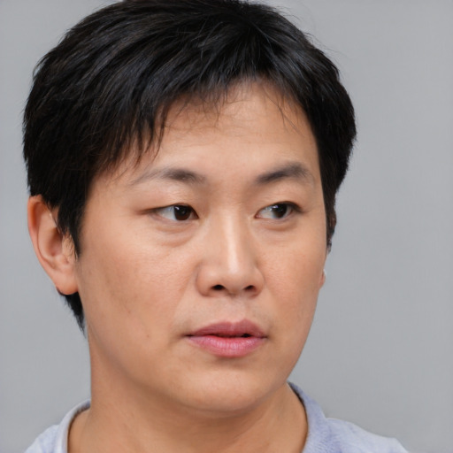 Neutral asian young-adult male with short  black hair and brown eyes