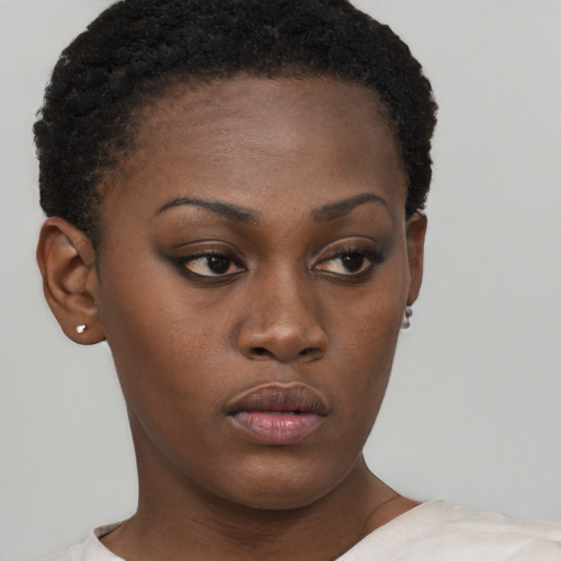 Neutral black young-adult female with short  brown hair and brown eyes