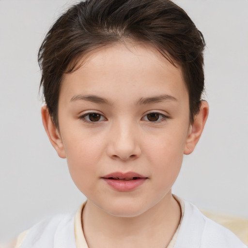 Joyful white child female with short  brown hair and brown eyes