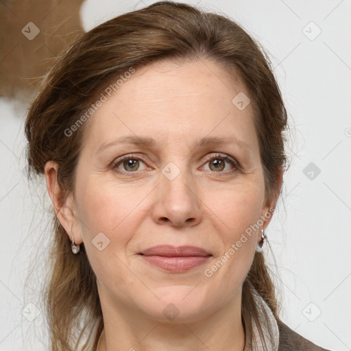 Joyful white adult female with medium  brown hair and grey eyes