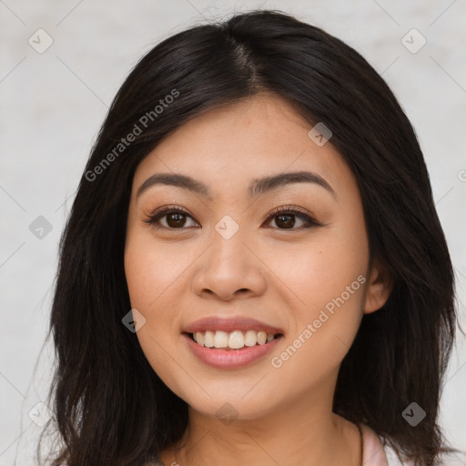 Joyful asian young-adult female with long  brown hair and brown eyes