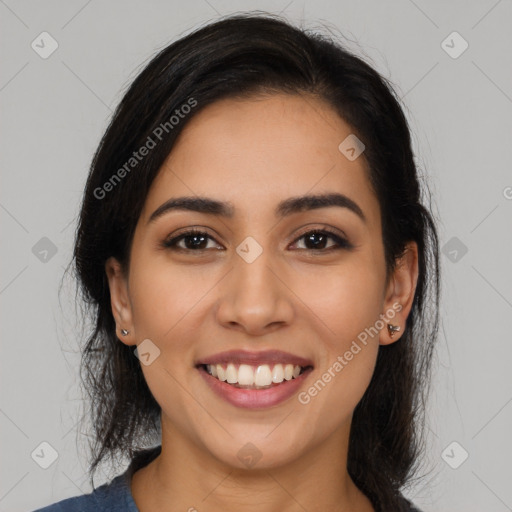 Joyful latino young-adult female with long  brown hair and brown eyes