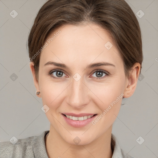 Joyful white young-adult female with short  brown hair and grey eyes