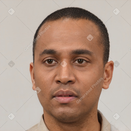 Neutral latino young-adult male with short  black hair and brown eyes