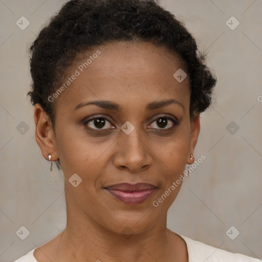 Joyful black young-adult female with short  brown hair and brown eyes