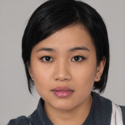 Neutral asian young-adult female with medium  black hair and brown eyes