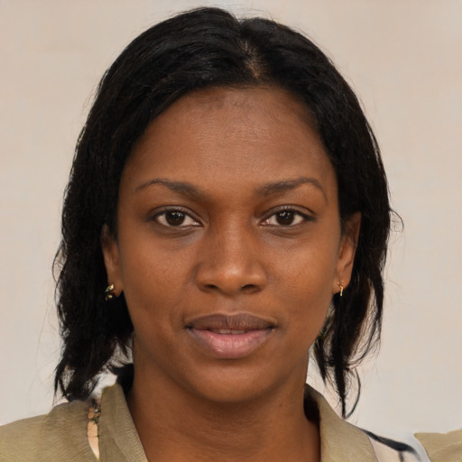 Neutral black young-adult female with medium  brown hair and brown eyes