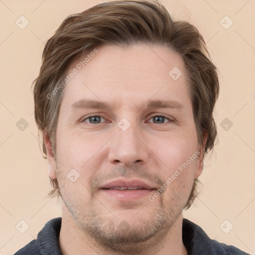 Joyful white adult male with short  brown hair and grey eyes