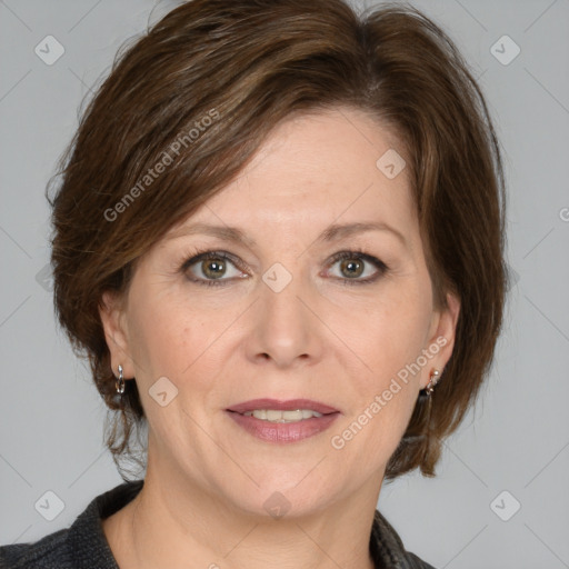 Joyful white adult female with medium  brown hair and grey eyes