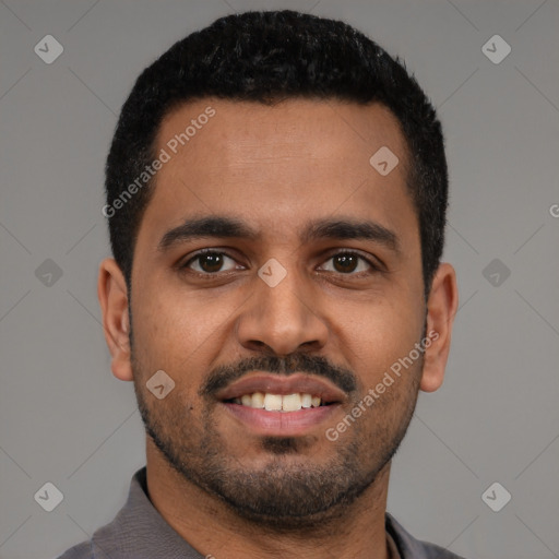 Joyful black young-adult male with short  black hair and brown eyes