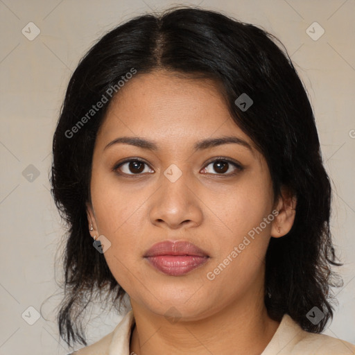 Joyful latino young-adult female with medium  brown hair and brown eyes