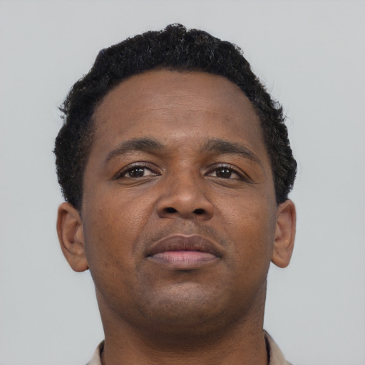 Neutral black young-adult male with short  brown hair and brown eyes