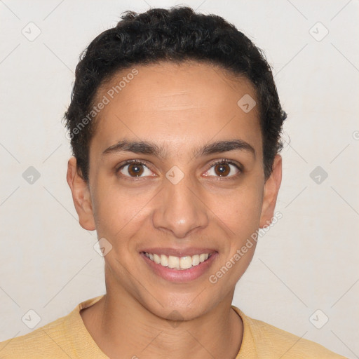 Joyful white young-adult male with short  black hair and brown eyes