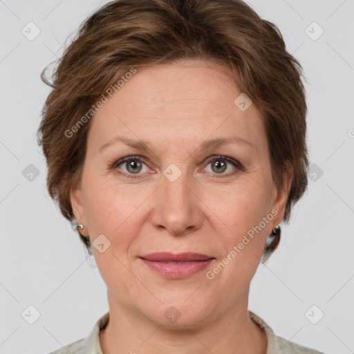 Joyful white adult female with short  brown hair and grey eyes