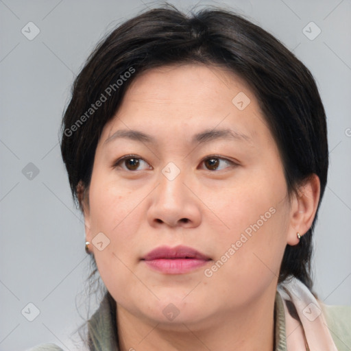 Joyful white adult female with medium  brown hair and brown eyes