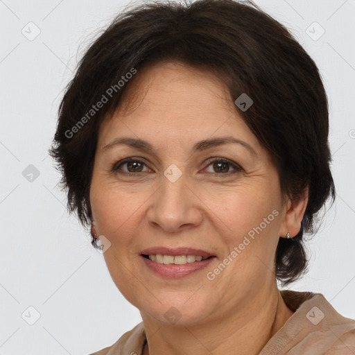 Joyful white adult female with medium  brown hair and brown eyes