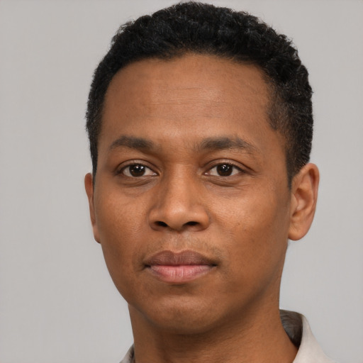 Neutral black young-adult male with short  black hair and brown eyes