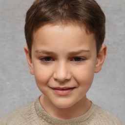 Joyful white child female with short  brown hair and brown eyes