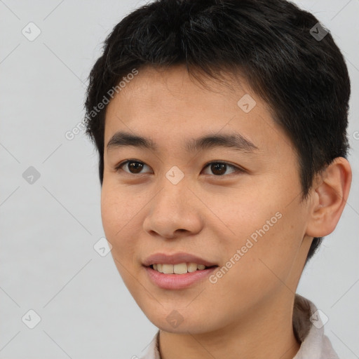 Joyful asian young-adult male with short  brown hair and brown eyes
