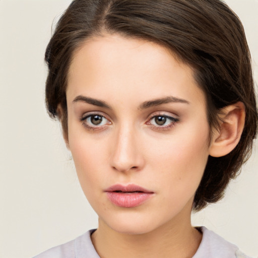 Neutral white young-adult female with medium  brown hair and brown eyes