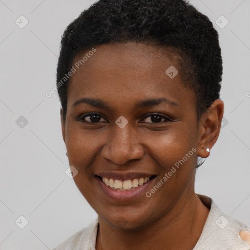 Joyful black young-adult female with short  brown hair and brown eyes