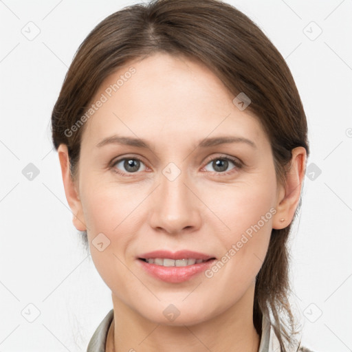 Joyful white young-adult female with medium  brown hair and grey eyes