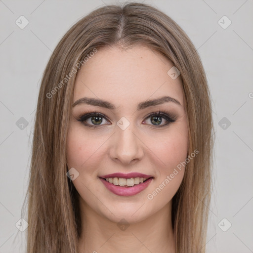 Joyful white young-adult female with long  brown hair and green eyes